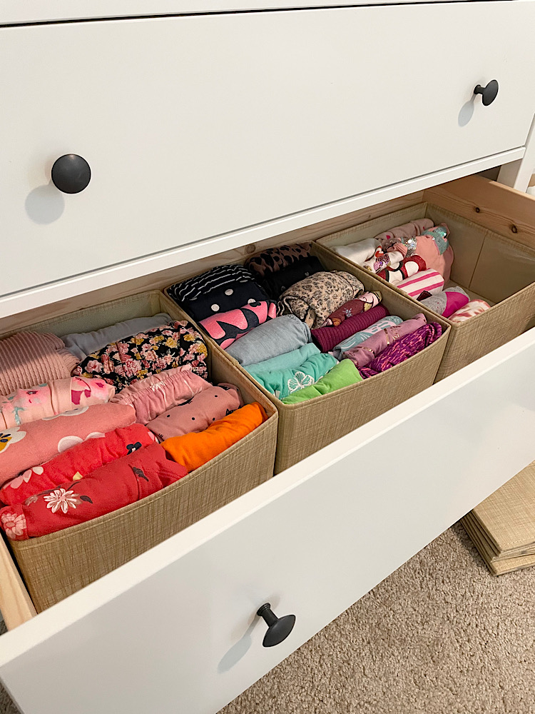 dresser with folded kids clothes