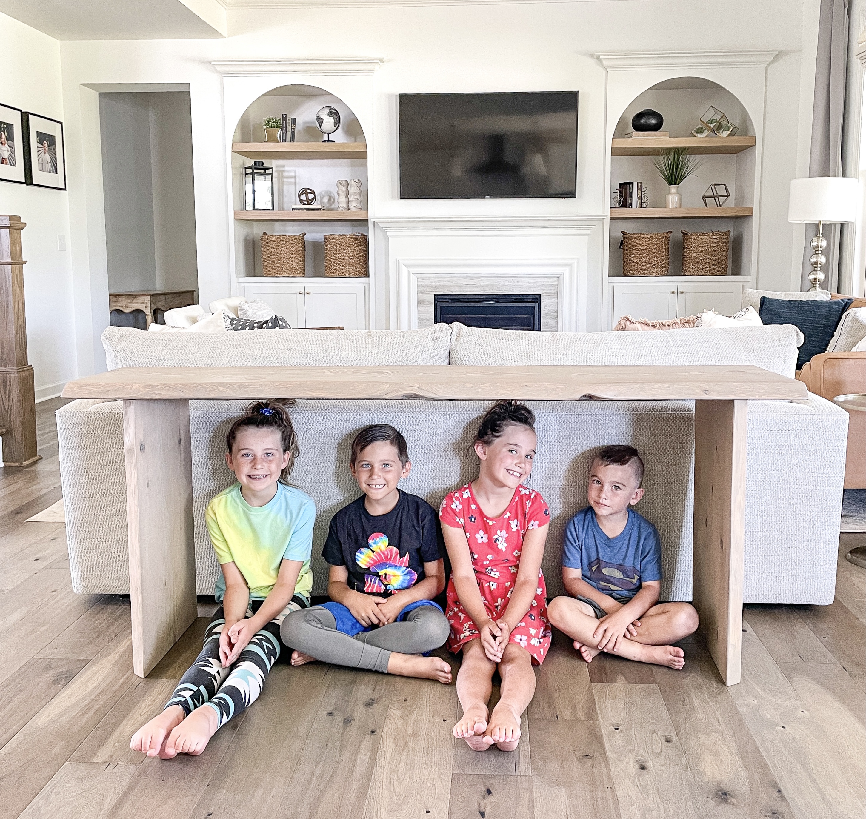 live edge console table with kids underneath