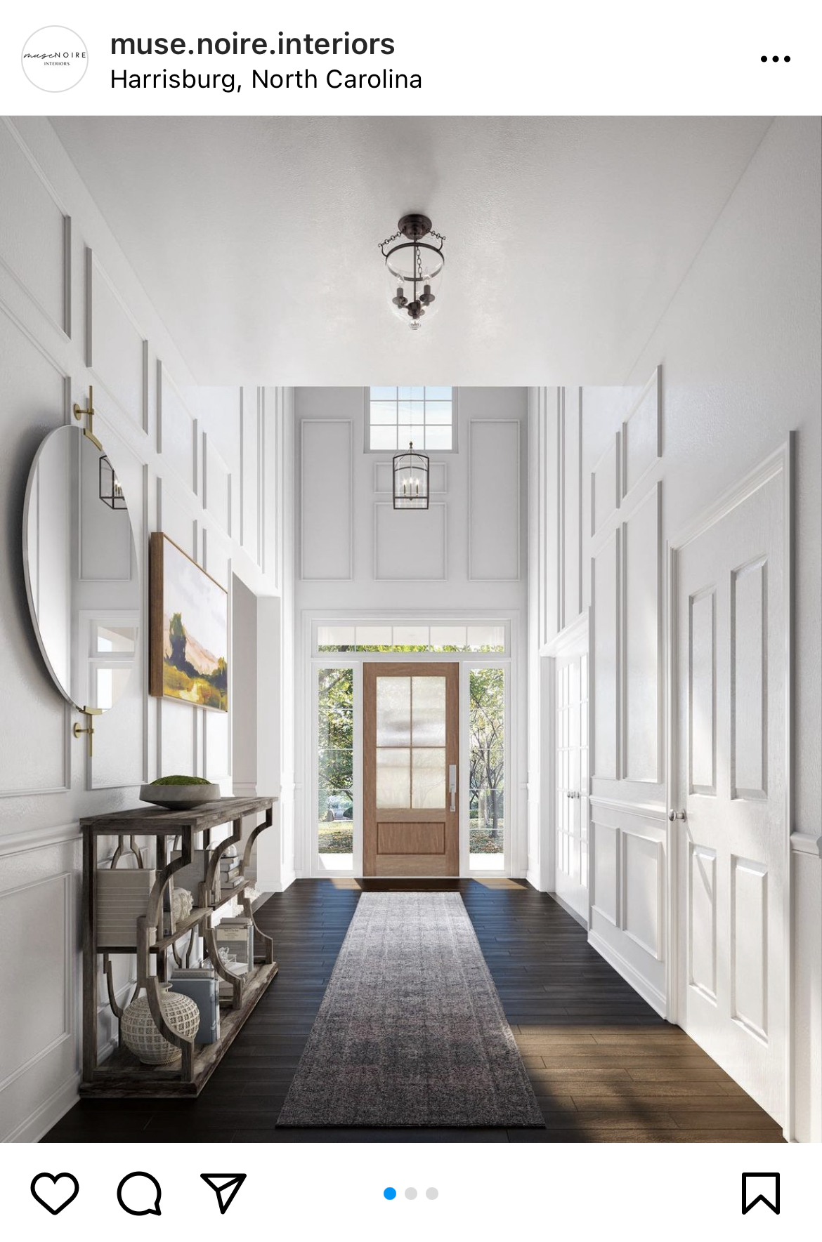 entrway with white walls and picture frame moulding 