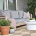 DIY outdoor Sofa on patio with gray cushions and checkered rug