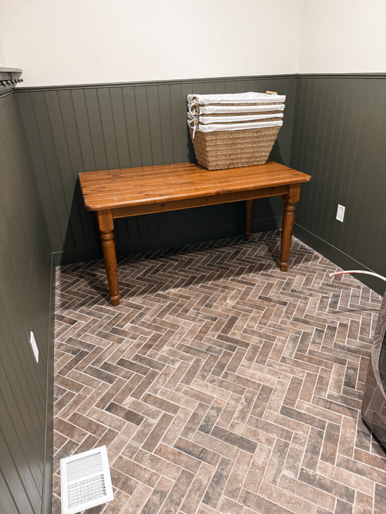 thrifted table as folding table in laundry room