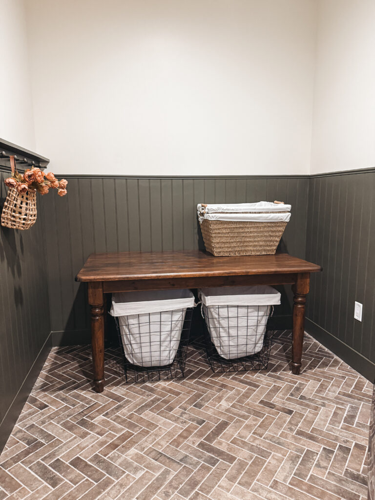 thrifted table flip a dark walnut color vintage table in laundry room with brick floor